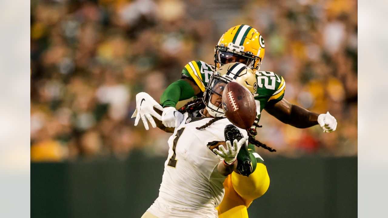 Green Bay Packers quarterback Danny Etling (19) runs for a touchdown during  an NFL Preseason game against the New Orleans Saints Friday, Aug. 19, 2022,  in Green Bay, Wis. (AP Photo/Jeffrey Phelps