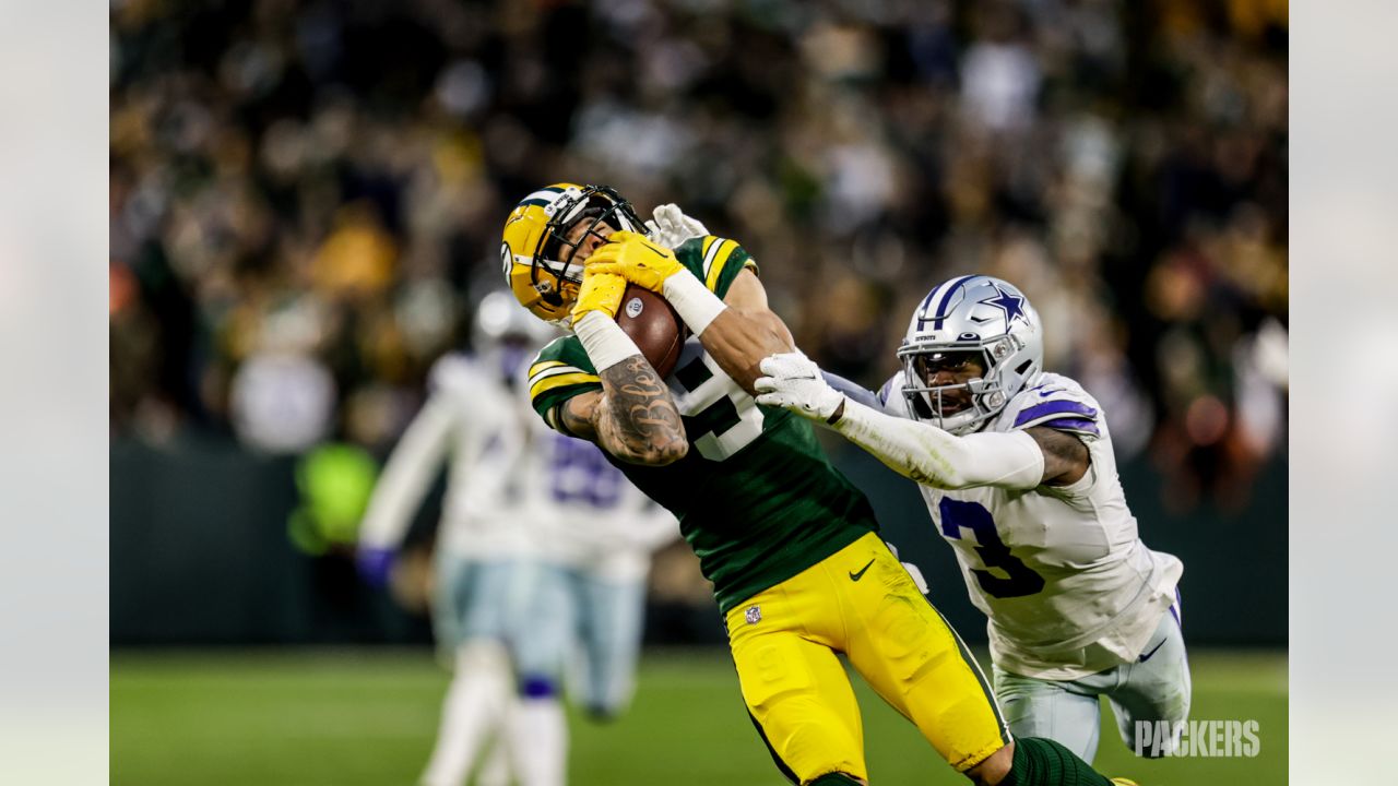 Green Bay Packers safety Rudy Ford (20) celebrates intercepting a Dallas  Cowboys quarterback Dak Prescott pass during the first half of an NFL  football game Sunday, Nov. 13, 2022, in Green Bay