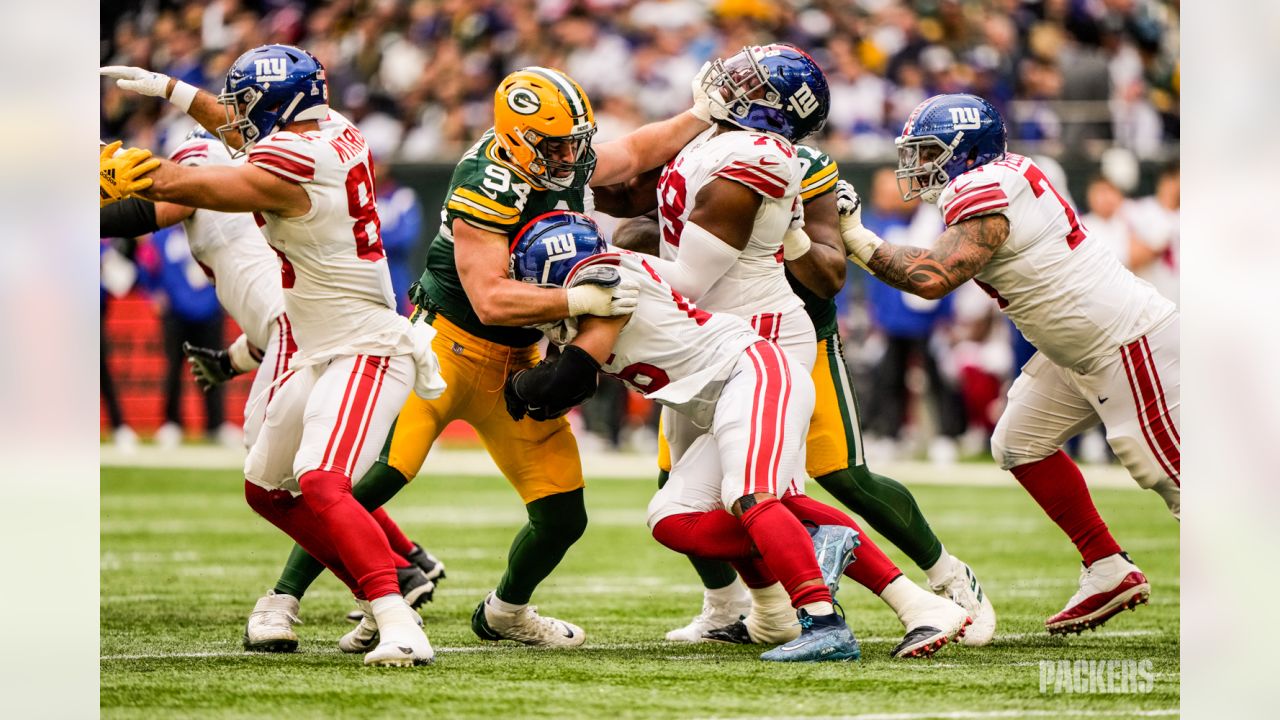 Green Bay Packers players form a huddle as they warm-up before an NFL game  between the New York Giants and the Green Bay Packers at the Tottenham  Hotspur stadium in London, Sunday