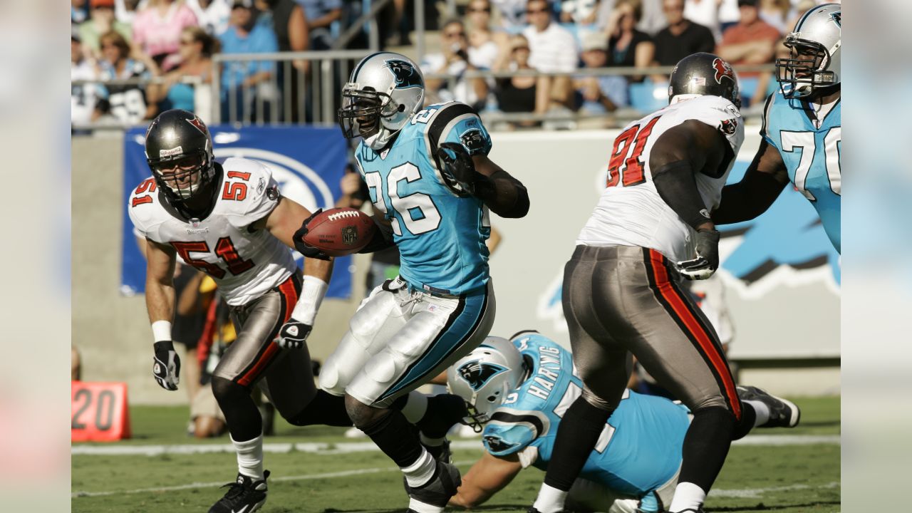 Tampa Bay Buccaneers vs. Carolina Panthers. NFL Game. American Football  League match. Silhouette of professional player celebrate touch down.  Screen in background. Stock Photo