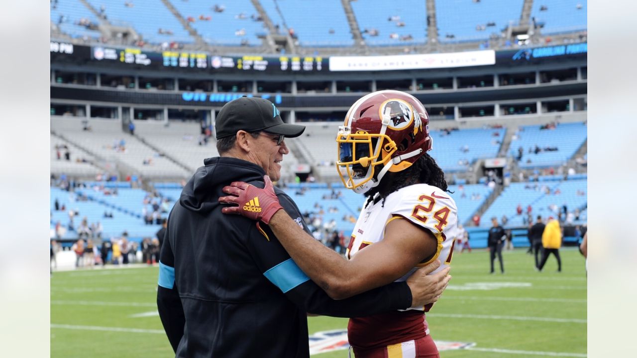 Landover, Maryland, USA. 14th Oct, 2018. Washington Redskins cornerback  Josh Norman (24) has words with Carolina Panthers quarterback Cam Newton  (1) during the NFL game between the Carolina Panthers and the Washington