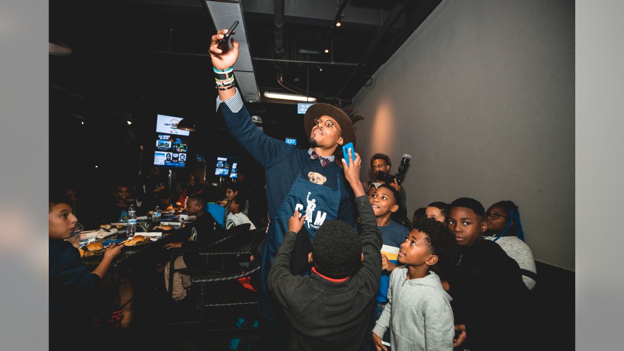 Cam Newton holds annual 'Thanksgiving Jam' for 1,200 children and their  families 