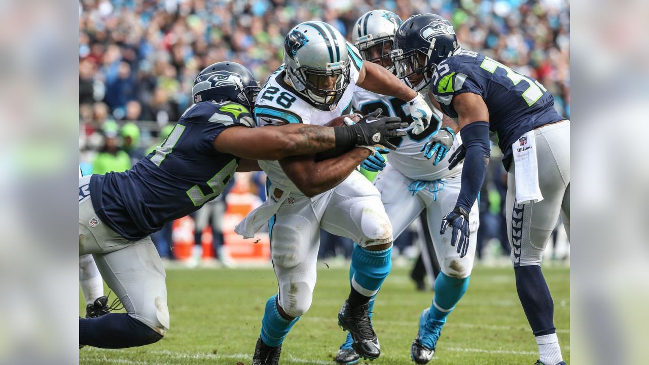 Carolina Panthers running back Jonathan Stewart, left, breaks free