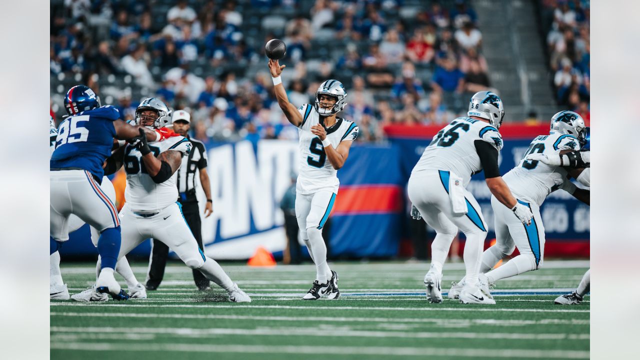 Carolina Panthers defensive tackle Marquan McCall (left) exchanges