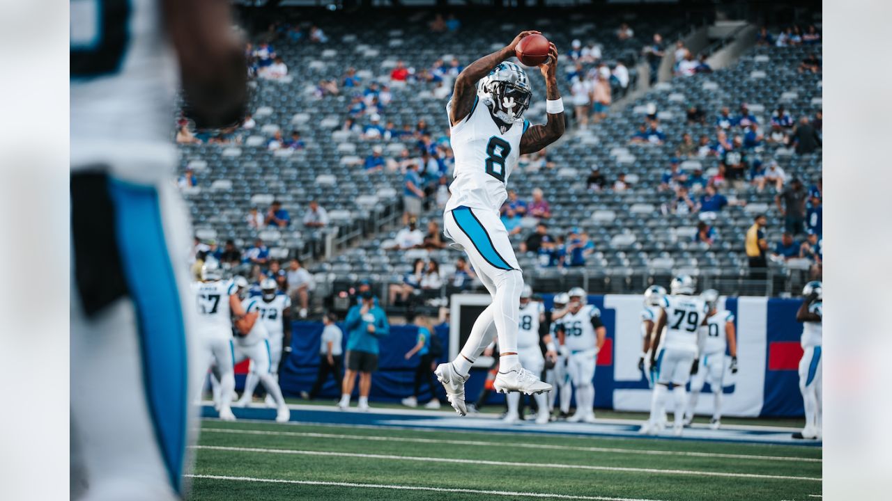 Carolina Panthers defensive tackle Marquan McCall (left) exchanges