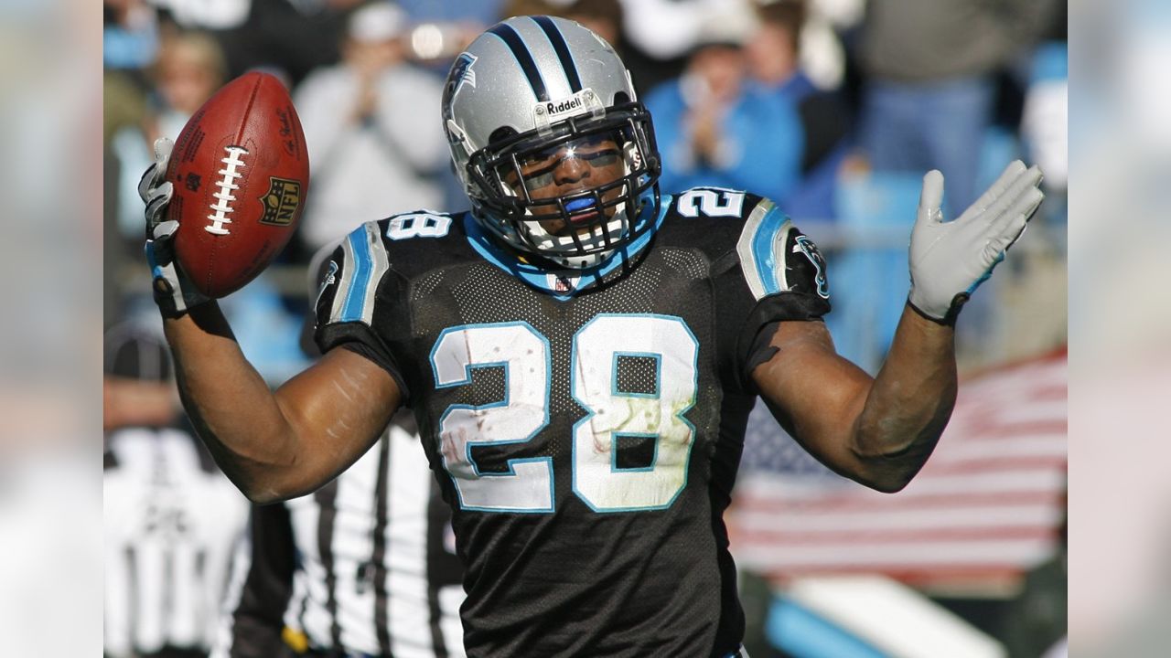 Carolina Panthers running back Jonathan Stewart, left, breaks free