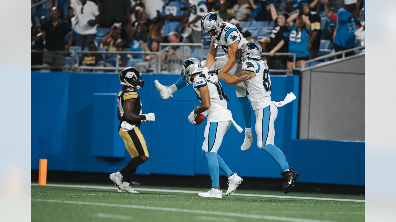 Carolina Panthers kicker Ryan Santoso wears a 9/11 FDNY hat during