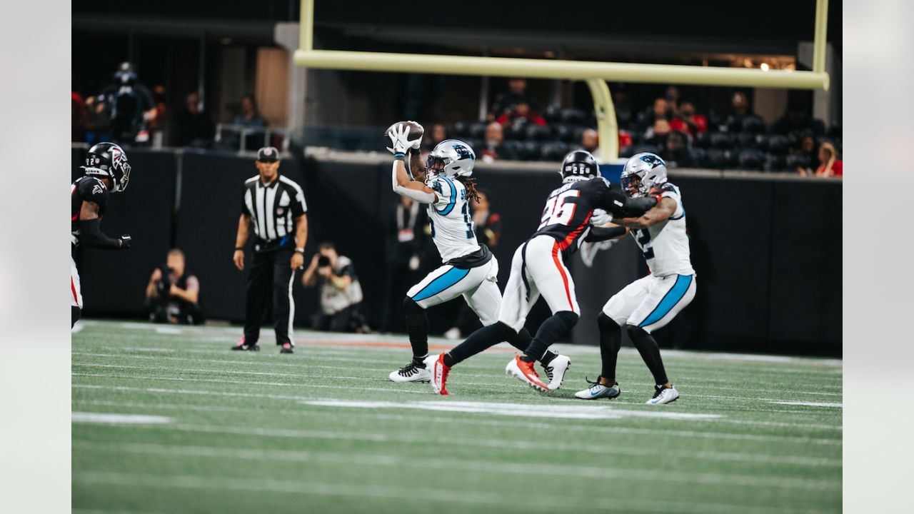 Fans dressed in Halloween costume watch play between the Atlanta Falcons  and the Carolina Panthers during the second half of an NFL football game,  Sunday, Oct. 31, 2021, in Atlanta. (AP Photo/Mark