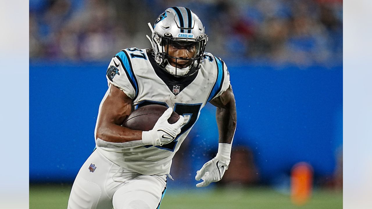 Buffalo Bills running back Duke Johnson (22) attempts to avoid the tackle  by Carolina Panthers cornerback Kalon Barnes (35) during an NFL preseason  football game on Friday, Aug. 26, 2022, in Charlotte