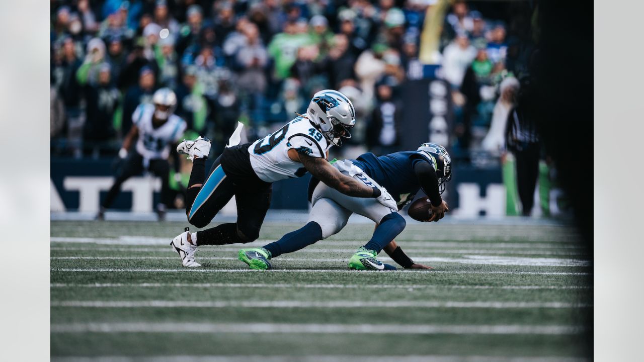 CHARLOTTE, NC - SEPTEMBER 25: Daviyon Nixon (54) of the Carolina Panthers  smiles as he brings the