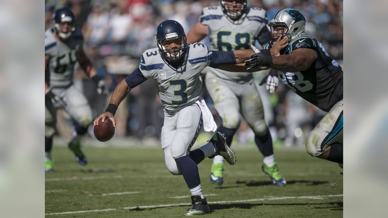 Carolina Panthers defensive tackle Derrick Brown (95) defends against  Seattle Seahawks quarterback Geno Smith (7) during