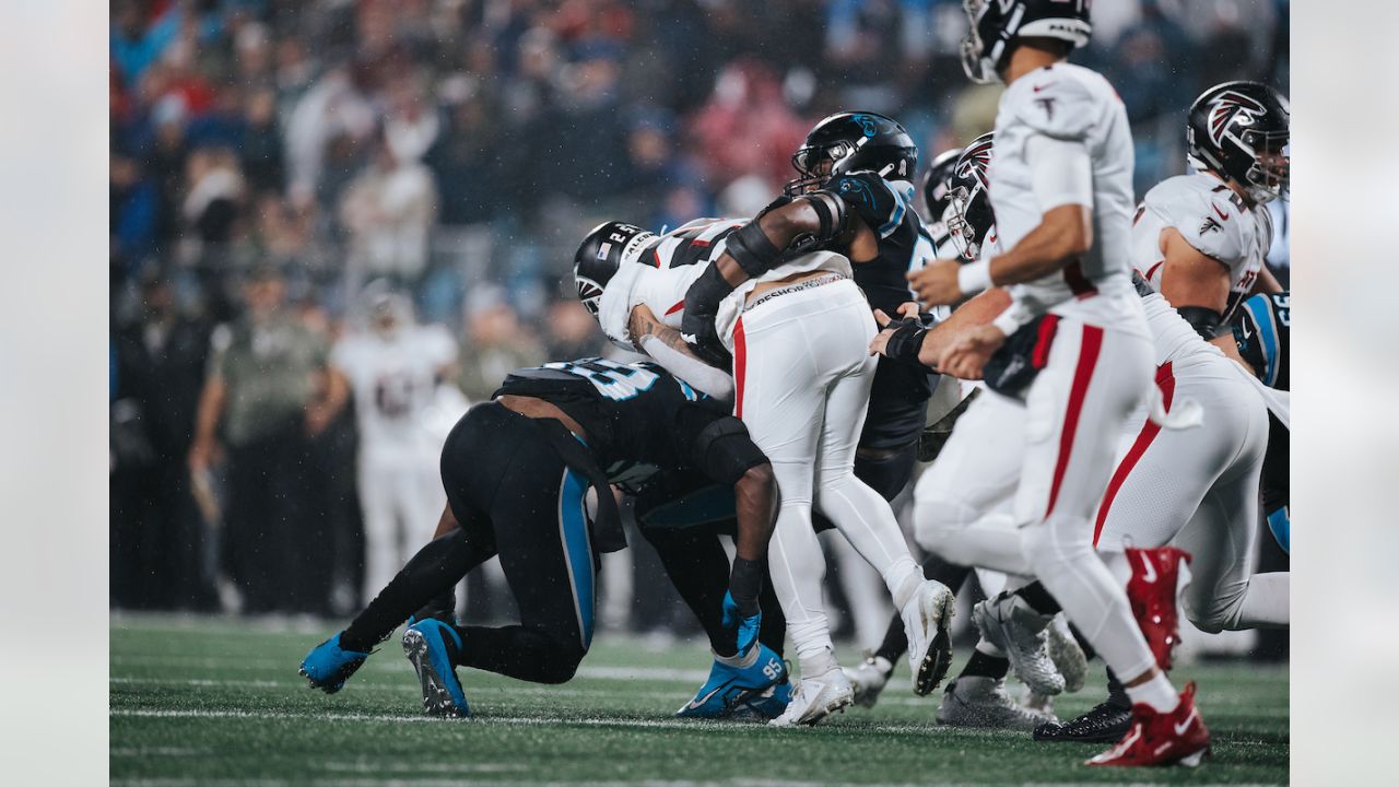 Carolina Panthers quarterback P.J. Walker isis tackled by