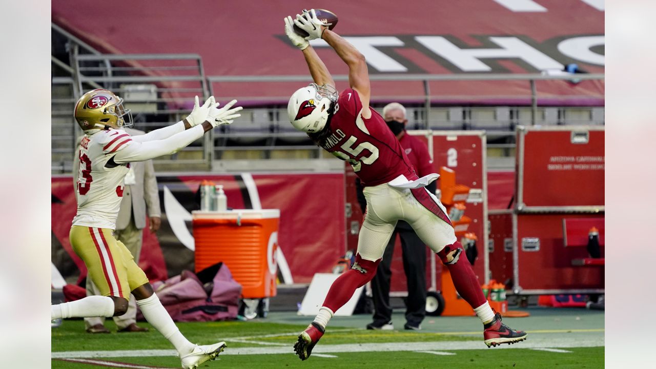 Arizona Cardinals tight end Dan Arnold (85) pulls in a catch as San Francisco 49ers defensive back Tarvarius Moore (33) defends during the first half of an NFL football game, Saturday, Dec. 26, 2020, in Glendale, Ariz. (AP Photo/Rick Scuteri)