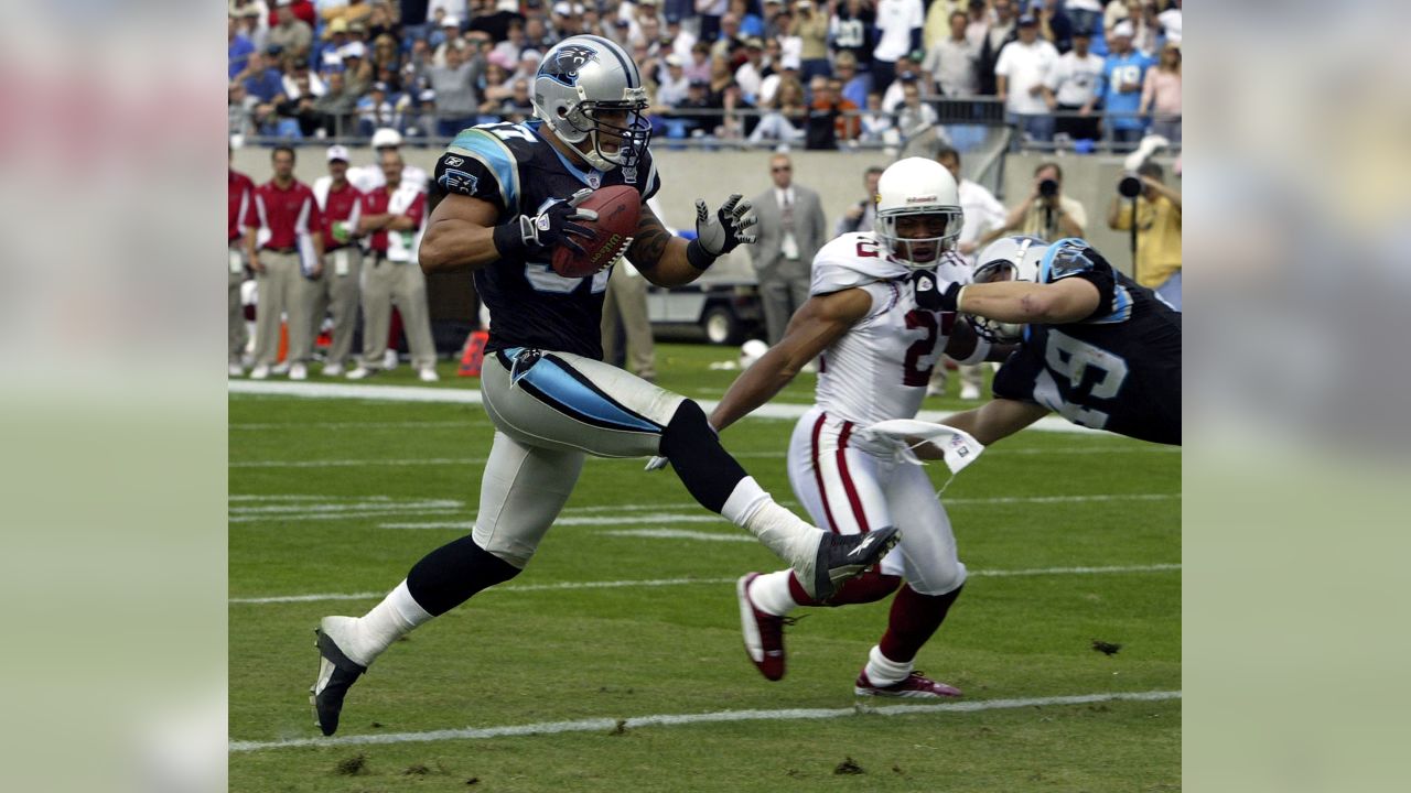 Carolina Panthers running back Mike Davis (28) is wrapped up by Arizona  Cardinals linebacker Isaiah Simmons (48) during an NFL football game,  Sunday, Oct. 4, 2020, in Charlotte, N.C. (AP Photo/Brian Westerholt