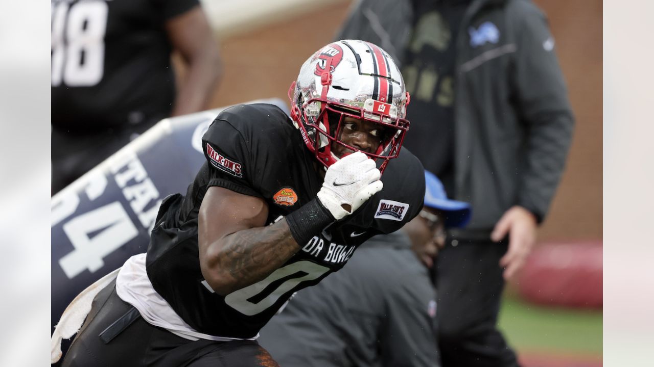 American Team defensive lineman DeAngelo Malone of Western Kentucky (10)  runs through drills during practice for