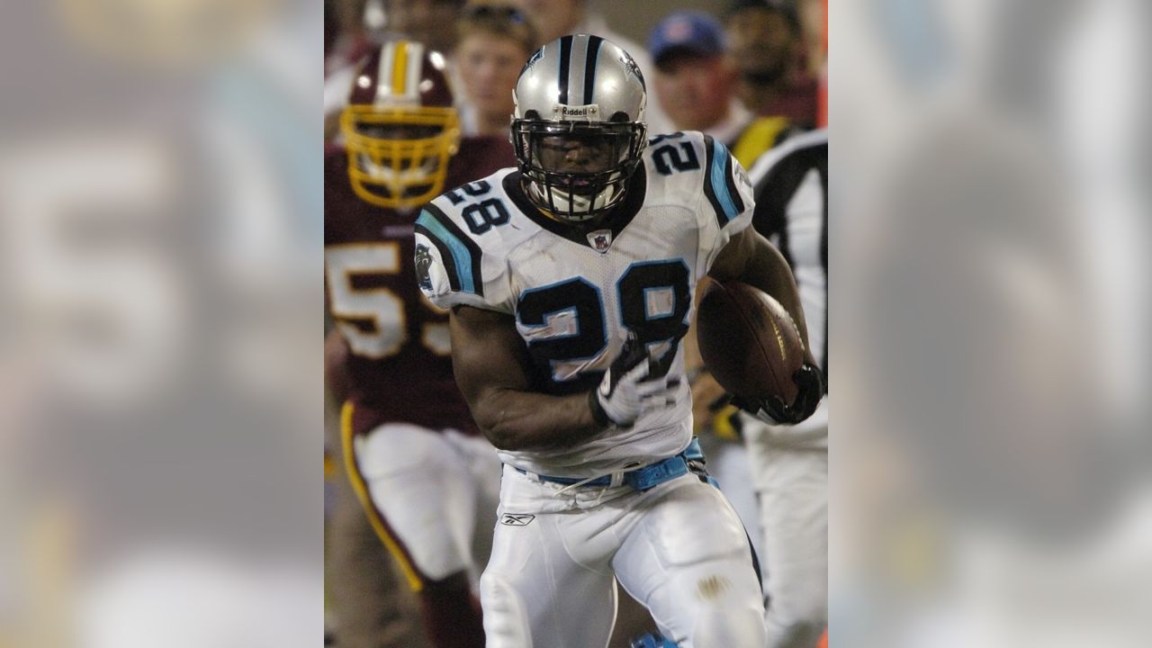 Carolina Panthers running back Jonathan Stewart, left, breaks free