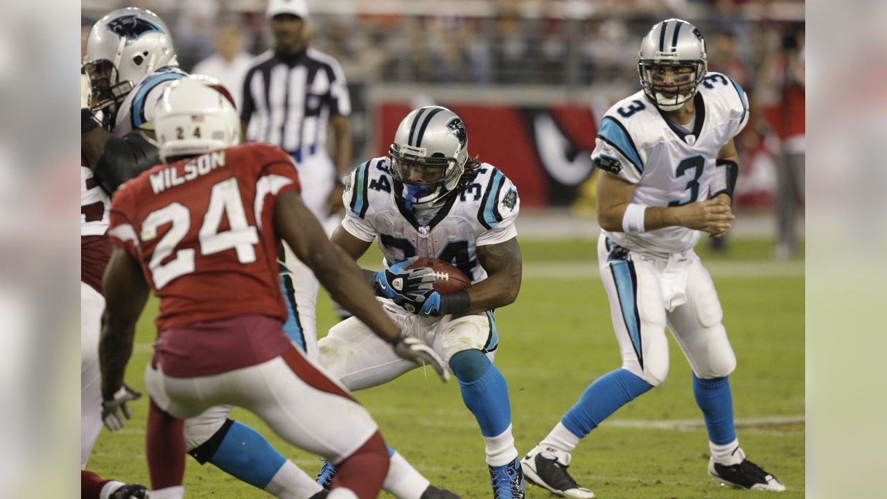 Carolina Panthers running back Mike Davis (28) is wrapped up by Arizona  Cardinals linebacker Isaiah Simmons (48) during an NFL football game,  Sunday, Oct. 4, 2020, in Charlotte, N.C. (AP Photo/Brian Westerholt