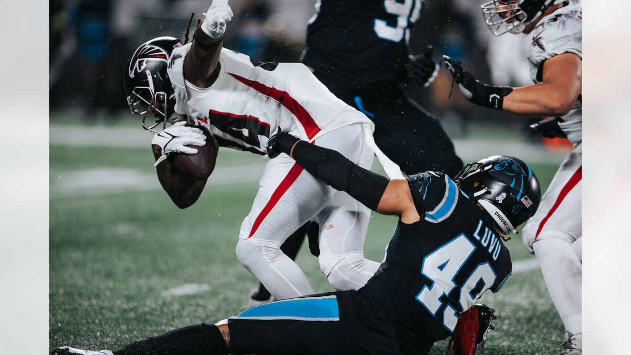 Carolina Panthers quarterback P.J. Walker isis tackled by