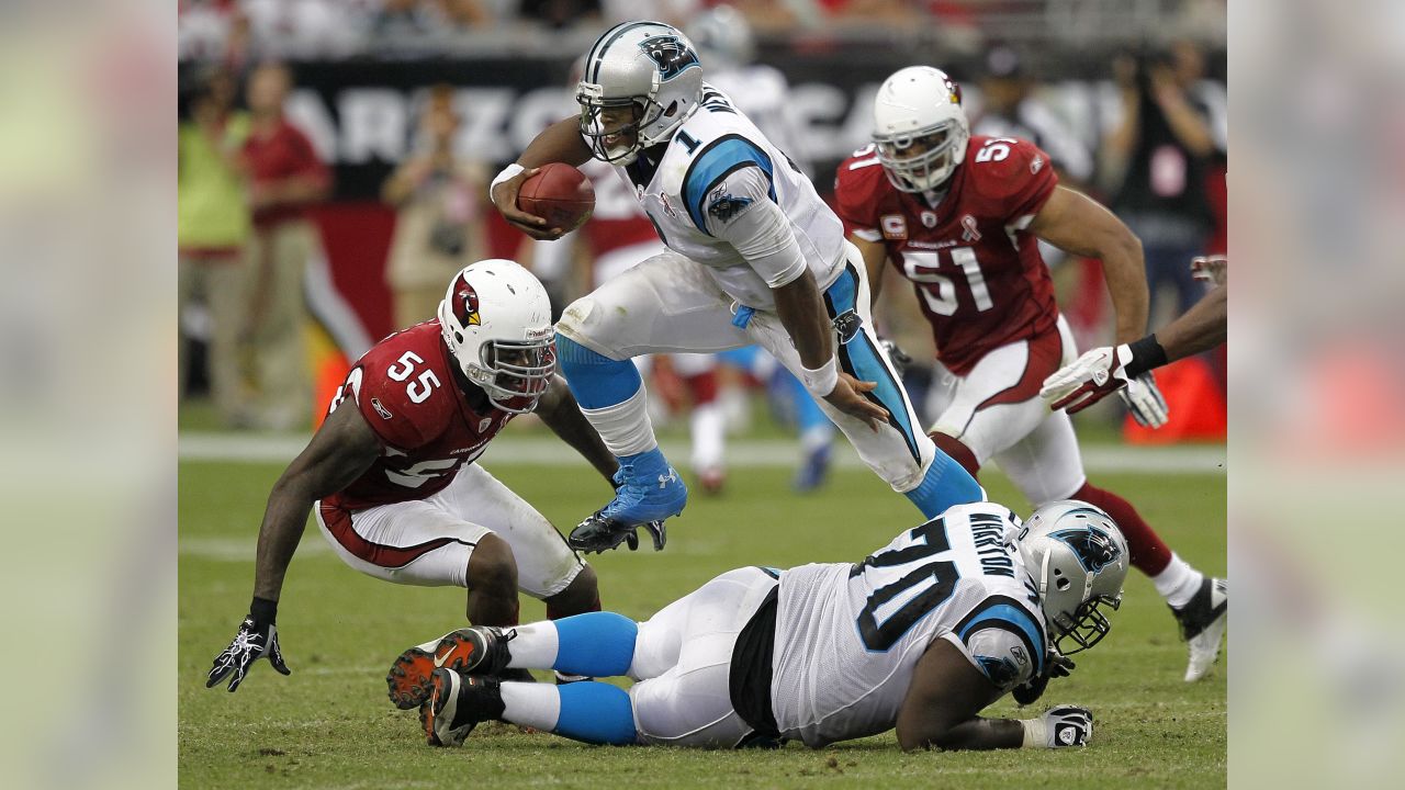 Carolina Panthers running back Mike Davis (28) is wrapped up by Arizona  Cardinals linebacker Isaiah Simmons (48) during an NFL football game,  Sunday, Oct. 4, 2020, in Charlotte, N.C. (AP Photo/Brian Westerholt