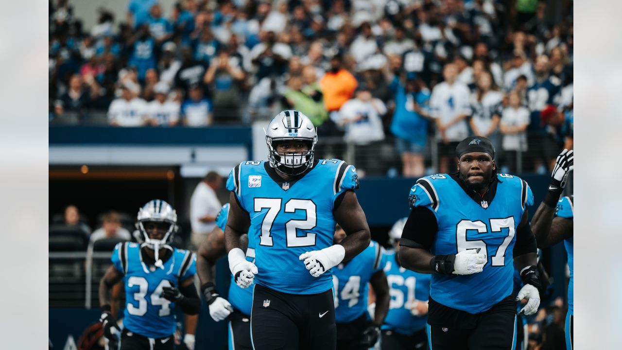 Carolina Panthers' Taylor Moton (72) runs a drill during the NFL