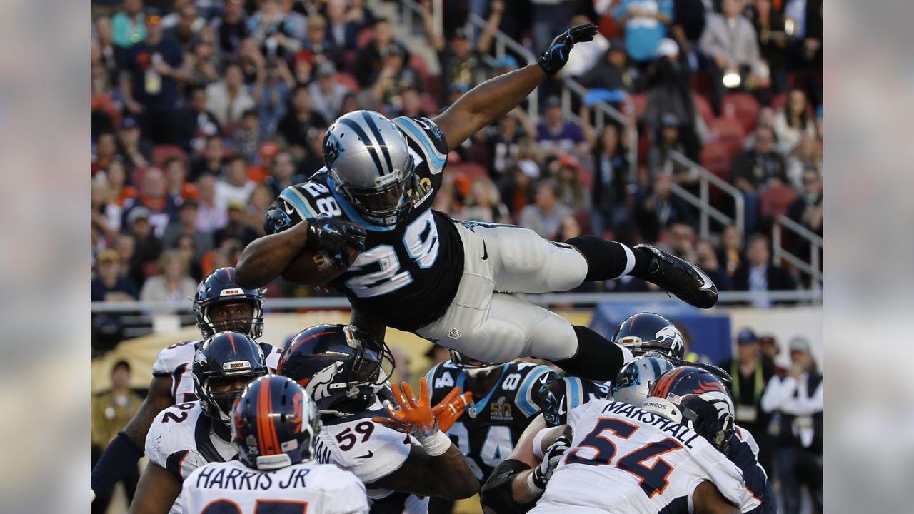 Carolina Panthers running back Jonathan Stewart, left, breaks free