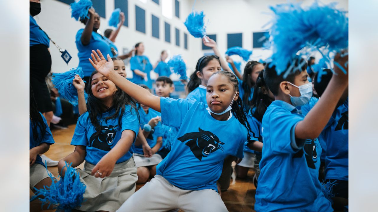 Students cheer reading at Carolina Panthers rally