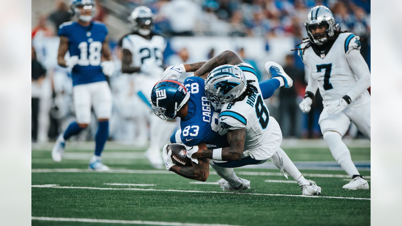 Carolina Panthers defensive tackle Marquan McCall (left) exchanges