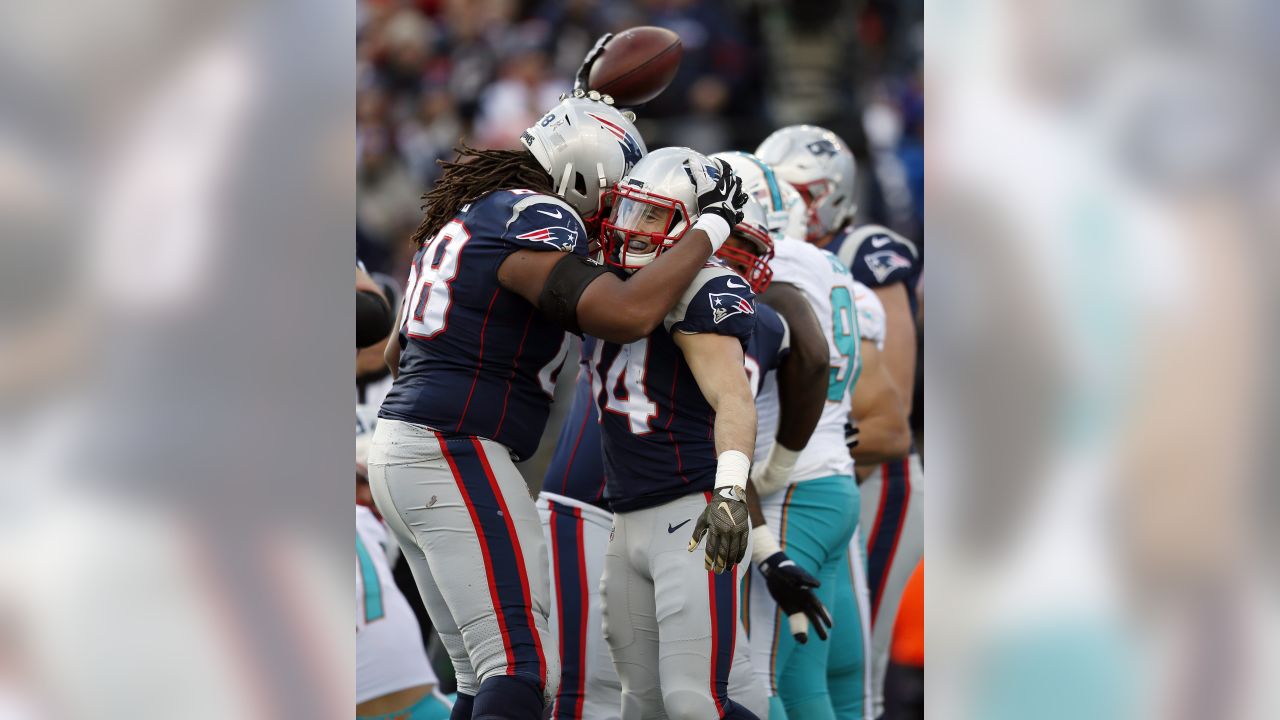 Miami Dolphins running back Malcolm Brown (34) scores a touchdown against  the Las Vegas Raiders during the first half of an NFL football game,  Sunday, Sept. 26, 2021, in Las Vegas. (AP