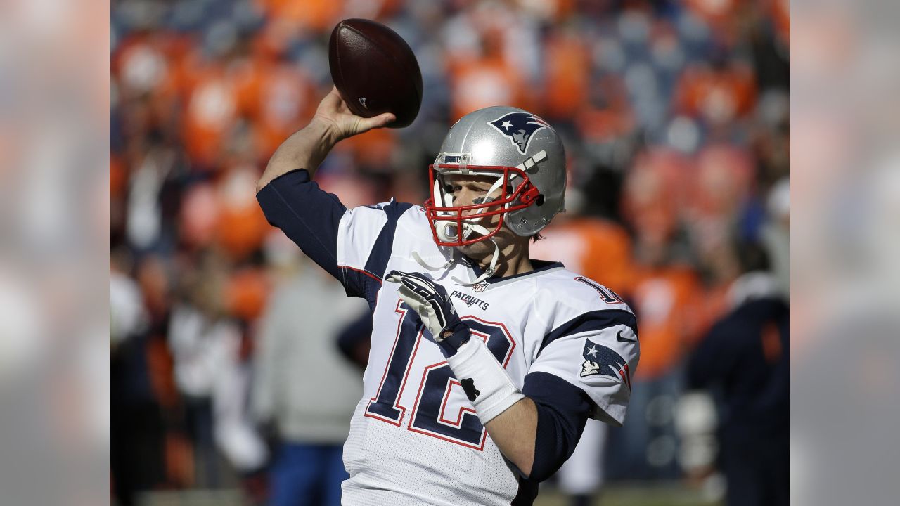 Denver Broncos Peyton Manning throws against the New England Patriots  during the AFC Championship game at Sport Authority Field at Mile High in  Denver on January 24, 2016. Denver advances to Super