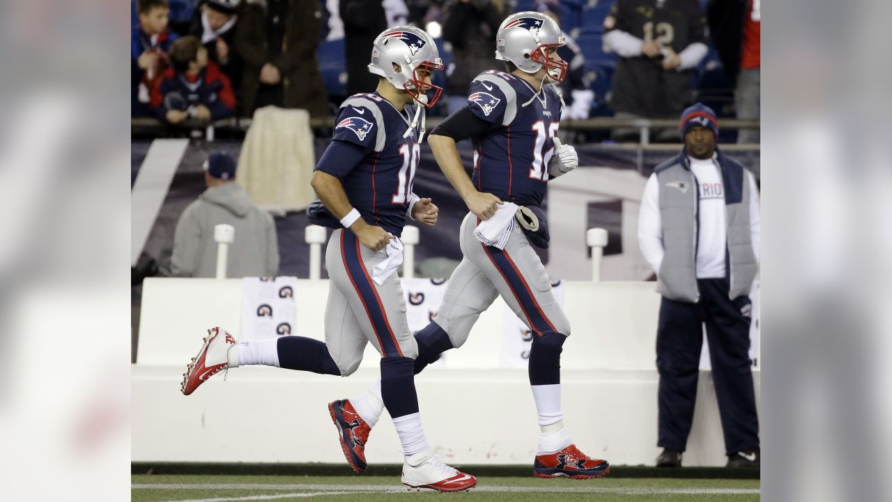 New England Patriots quarterback Tom Brady (12) quarterback Jimmy Garoppolo  (10) while warming up before the game against the Atlanta Falcons at  Gillette Stadium in Foxborough, Massachusetts on October 22, 2017. Photo