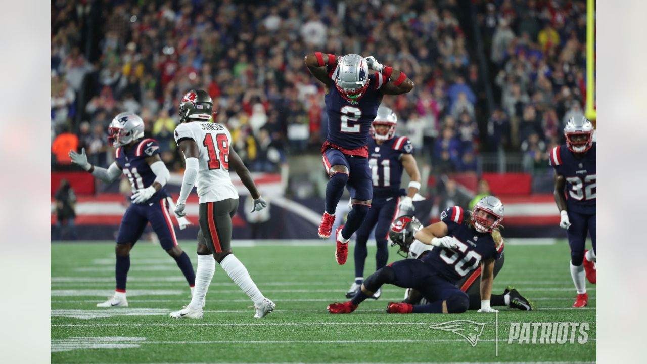 New England Patriots fullback Jakob Johnson, right, dives for the ball  against Tampa Bay Buccan …