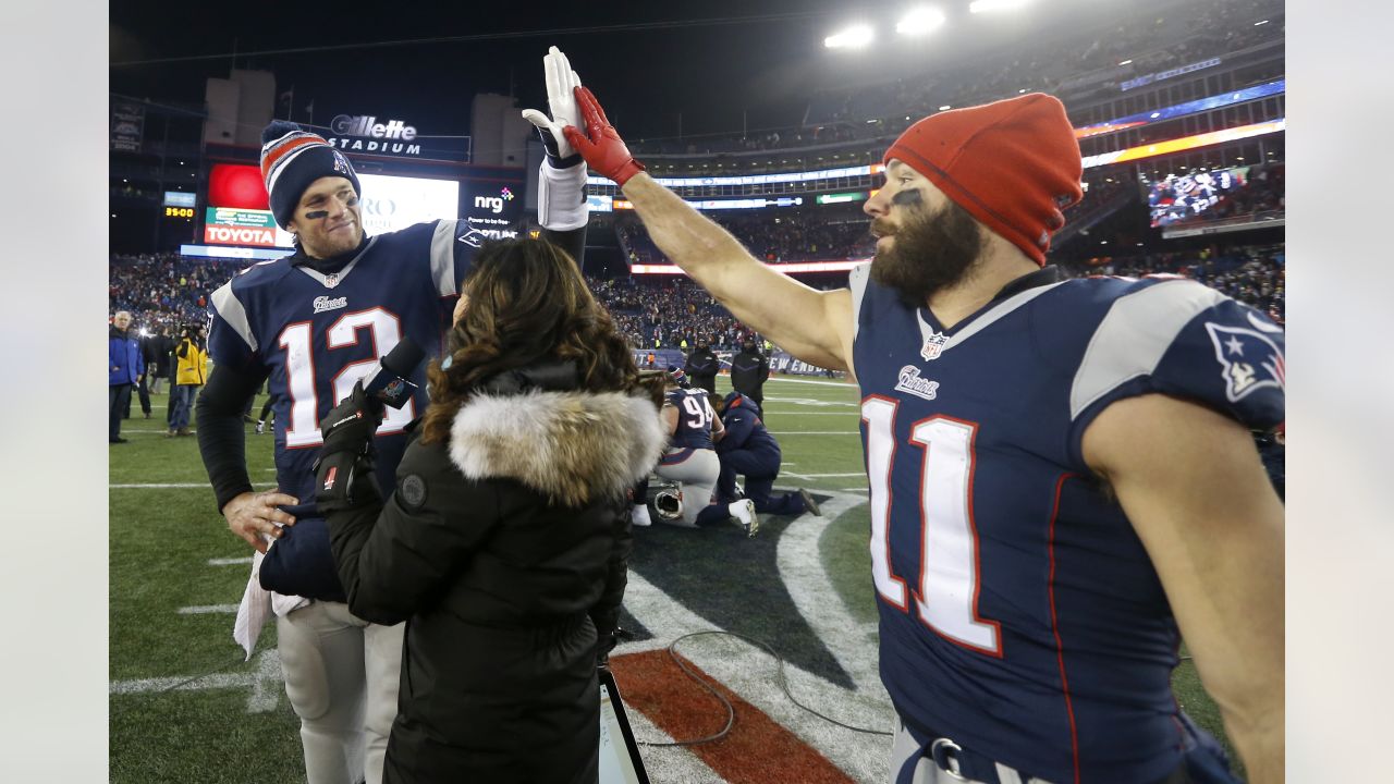 New England Patriots quarterback Tom Brady (12) jokes with New England  Patriots wide receiver Troy Brown before the game against the Jacksonville  Jaguars at Gillette Stadium in Foxboro, Massachusetts on January 12