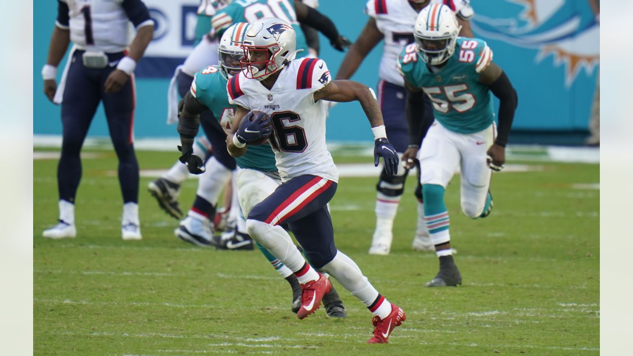 Miami Dolphins running back Lynn Bowden (15) runs after a catch against the  New England Patriot …