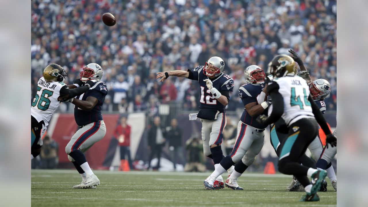 New England Patriots tight end Rob Gronkowski, rear, is hit by Jacksonville  Jaguars safety Barry Church as he breaks up a pass during the first half of  the AFC championship NFL football