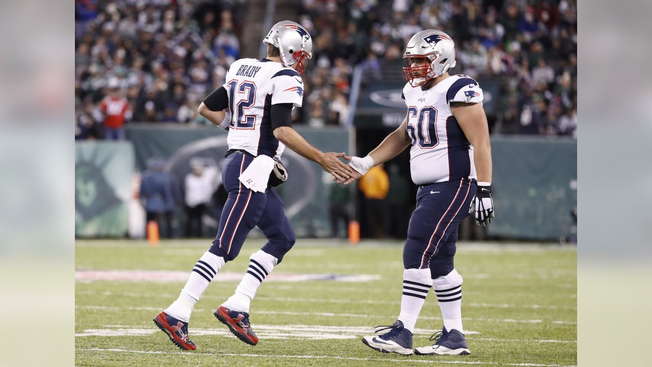 New England Patriots center David Andrews (60) congratulates