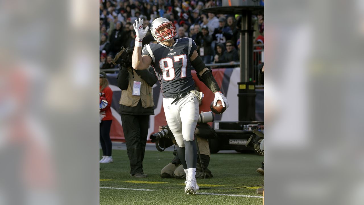 New England Patriots tight end Rob Gronkowski (87) is tripped up by Miami  Dolphins cornerback Will Allen (25) on a 9-yard reception in the fourth  quarter at Gillette Stadium in Foxboro, Massachusetts