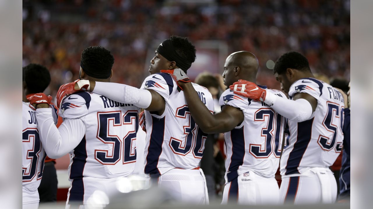 New England Patriots defensive back Devin McCourty (32) and linebacker  Brandon King (36) celebrate a fumble recovery by McCourty in the third  quarter against the Indianapolis Colts at Gillette Stadium in Foxborough