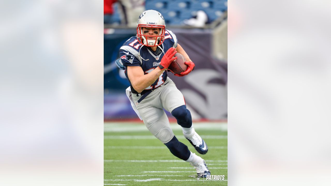 Julian Edelman, wide receiver for the New England Patriots, shakes the  hands of Marines from Marine Corps Band New Orleans before the start of the  game against the Seattle Seahawks at Gillette