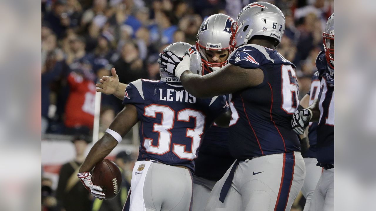 New England Patriots wide receiver Julian Edelman (11) is congratulated by  teammate Sebastian Vollmer after catching a touchdown against the  Indianapolis Colts in the first half of an NFL football game in