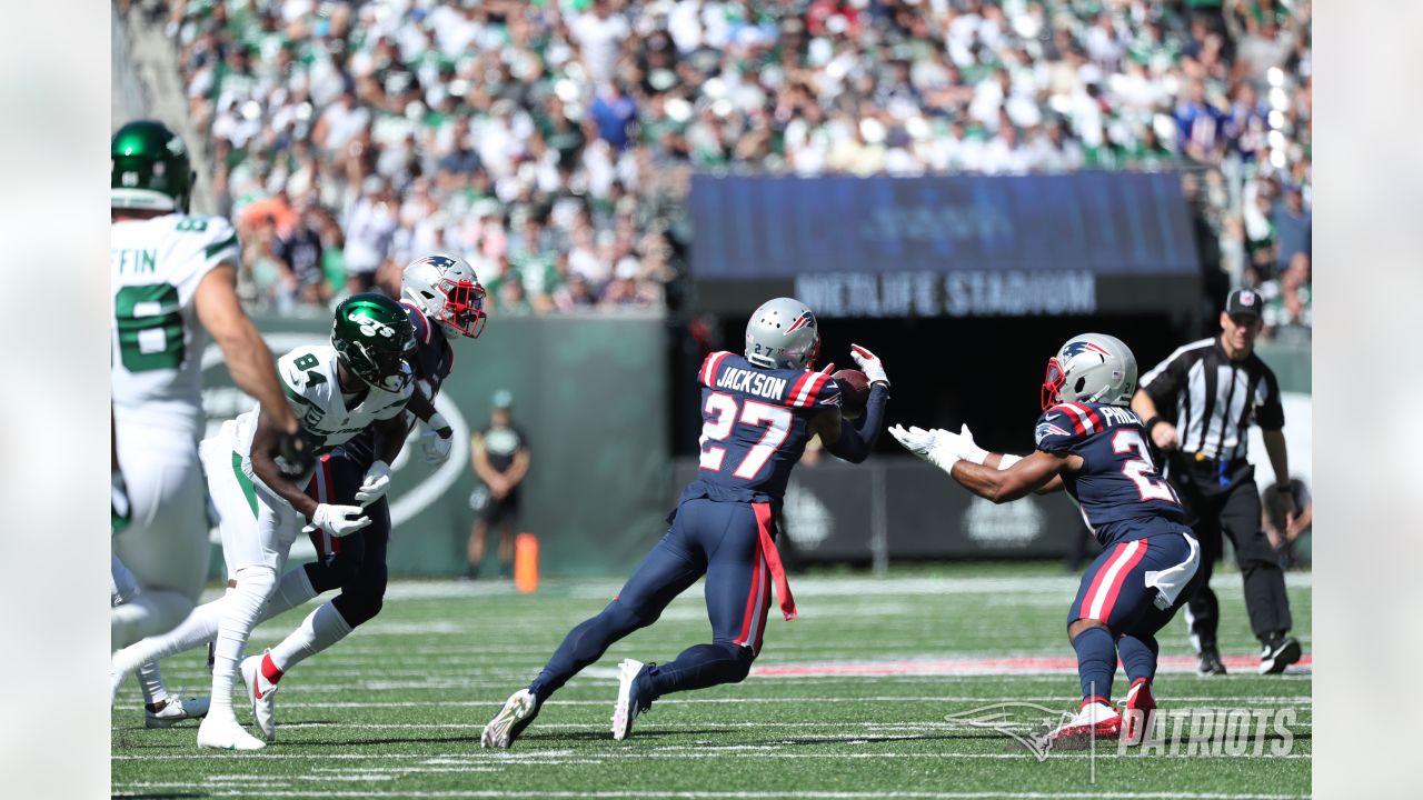 New England Patriots cornerback J.C. Jackson (27) celebrates his  interception with New England …