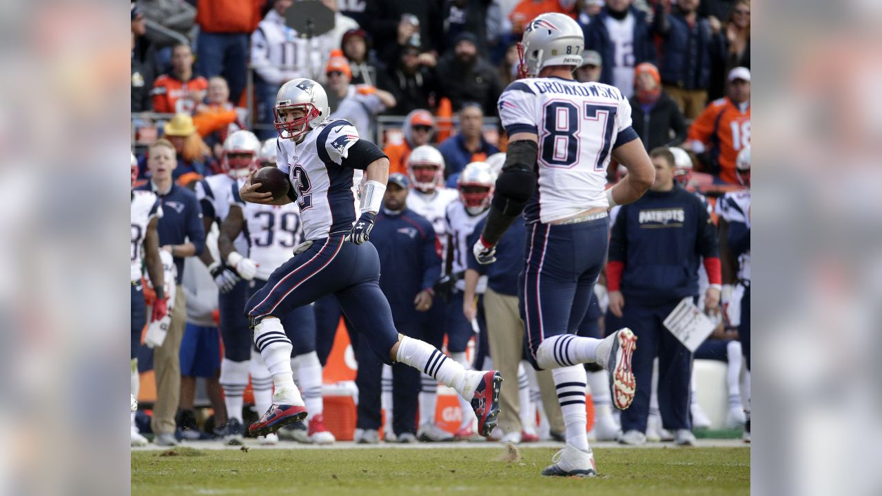 Tom Brady (12) of the New England Patriots throws a pass during the AFC  Championship game at Sports Authority Field at Mile High in Denver on  January 19, 2014. The New England-Denver