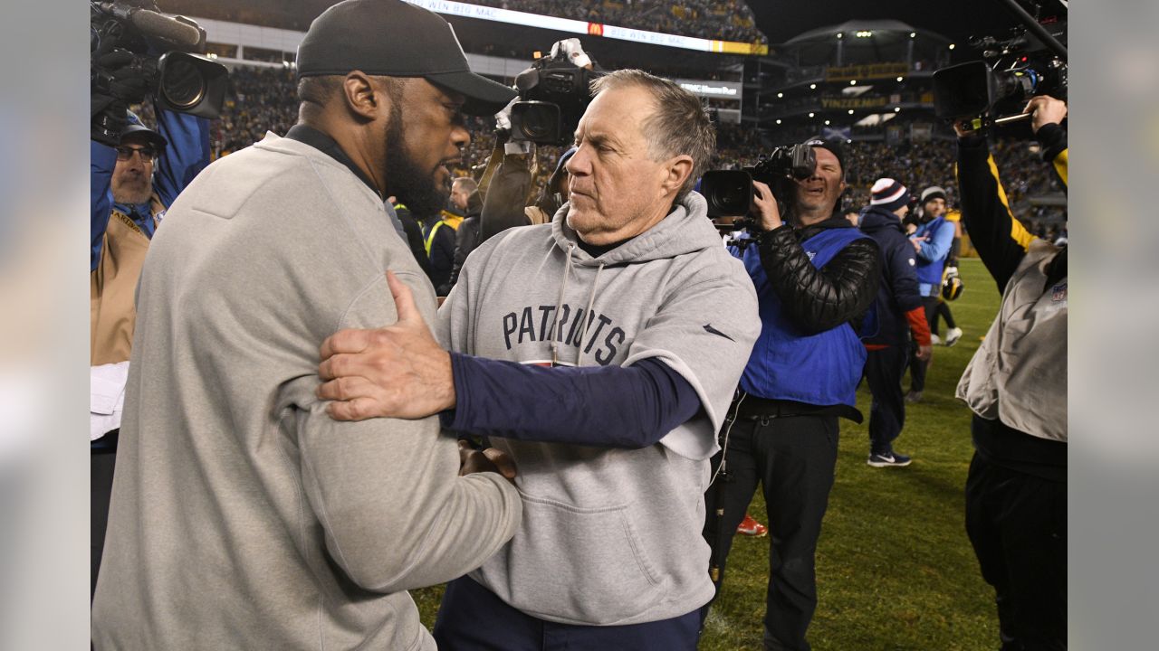 Pittsburgh Steelers head coach Mike Tomlin, left, and New England Patriots head coach Bill Belichick talk on the field following an NFL football game in Pittsburgh, Sunday, Dec. 16, 2018. The Steelers won 17-10. (AP Photo/Don Wright)