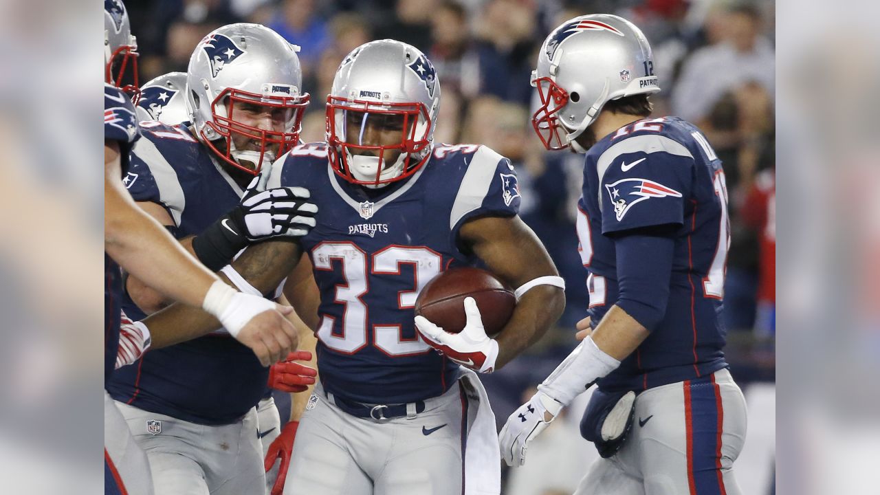 New England Patriots wide receiver Julian Edelman (11) is congratulated by  teammate Sebastian Vollmer after catching a touchdown against the  Indianapolis Colts in the first half of an NFL football game in