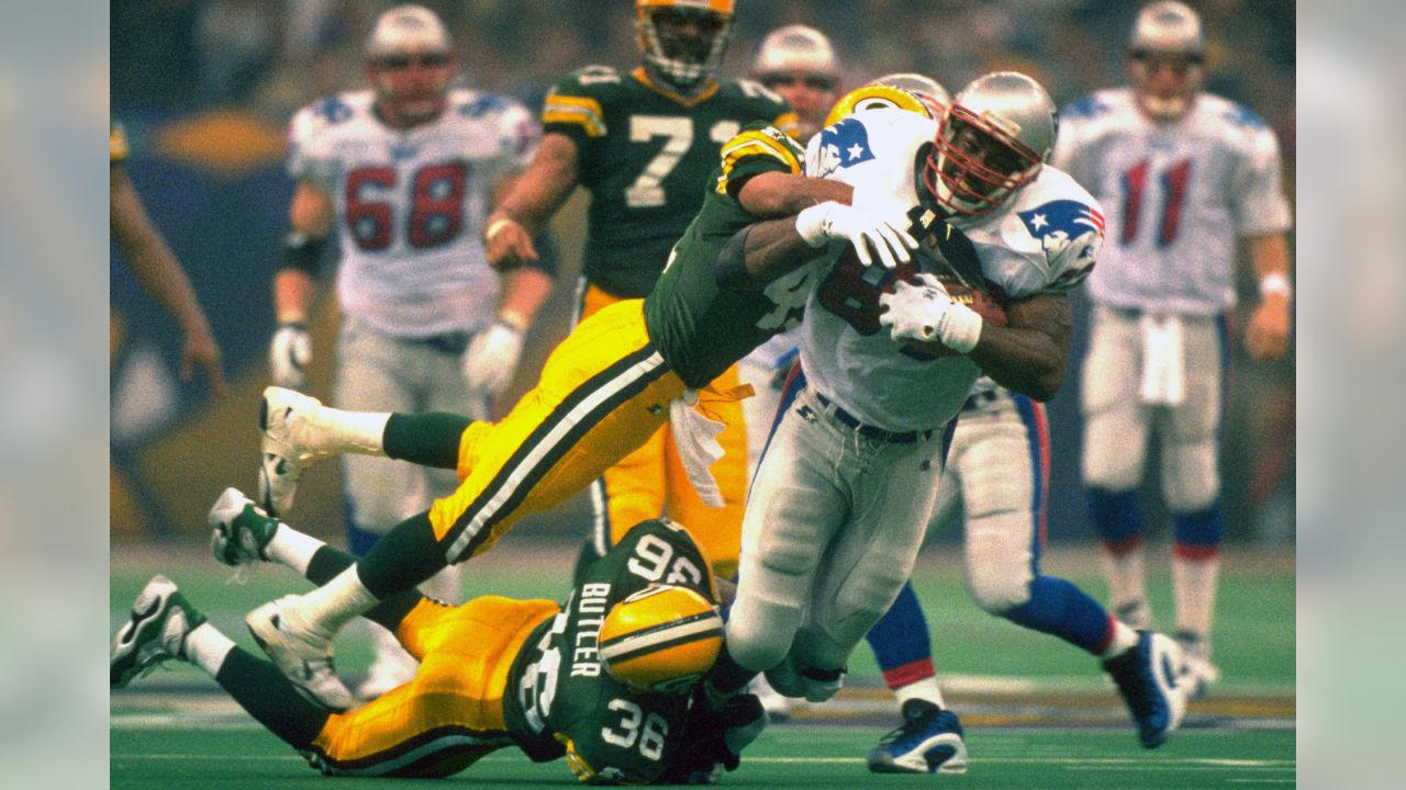 FILE - In this Sunday, Jan. 12, 1997, file photo, Green Bay Packers  defensive end Reggie White celebrates in the closing minutes of the NFC  Championship game against the Carolina Panthers at