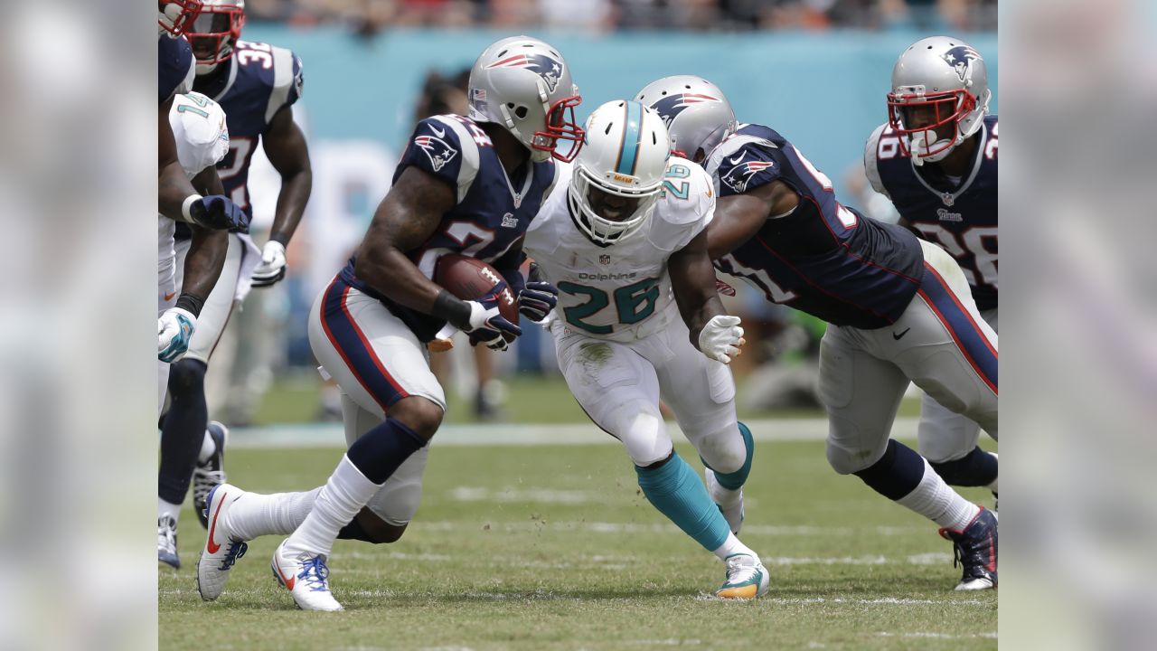 Tennessee Titans quarter back Jake Locker (10) runs against the Miami  Dolphins during first half action at Sun Life Stadium November 11, 2012 in  Miami, Florida. The Tennessee Titans beat the Miami