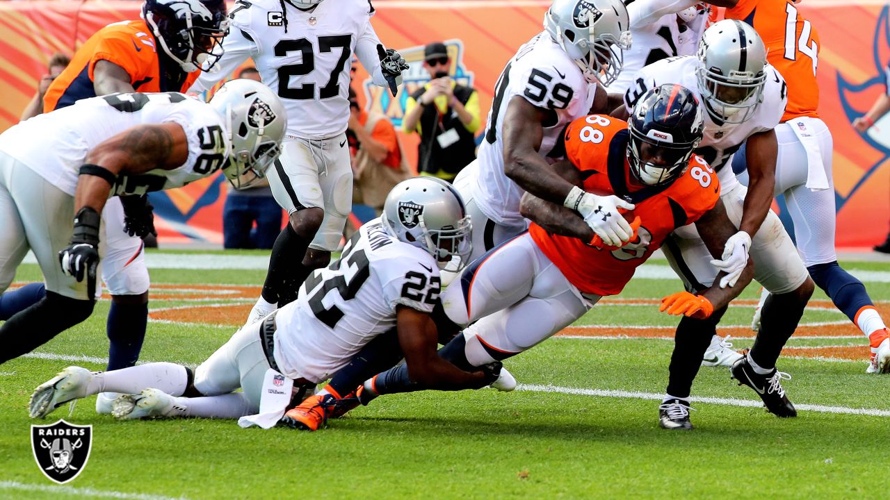 Los Angeles, USA. October 07, 2018 Los Angeles Chargers running back Melvin  Gordon (28) carries the ball as Oakland Raiders linebacker Tahir Whitehead  (59) makes the tackle during the football game between