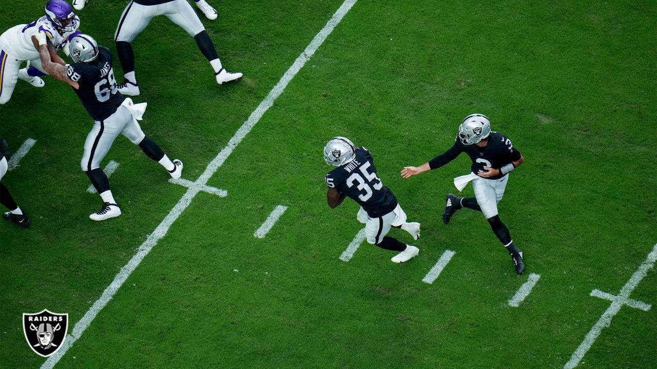 Las Vegas Raiders quarterback Jarrett Stidham is tackled by Minnesota  Vikings defensive tackle T.Y. McGill during the first half of an NFL  preseason football game, Sunday, Aug. 14, 2022, in Las Vegas. (