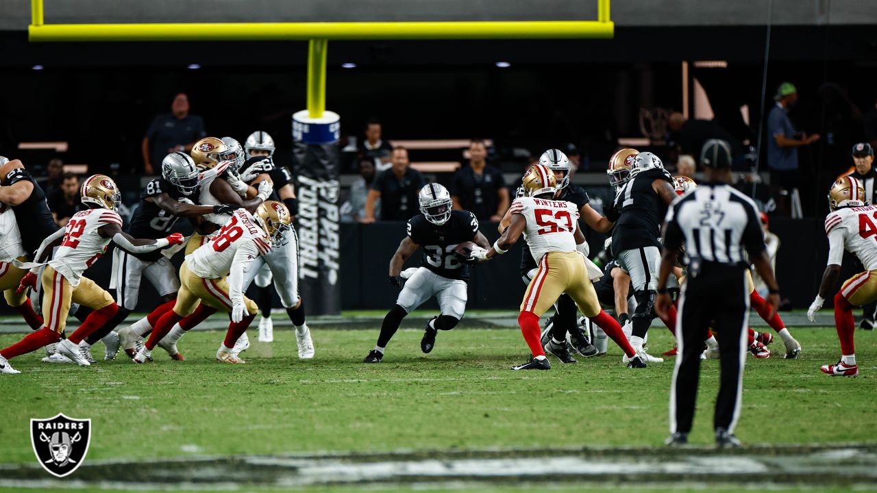 Las Vegas Raiders running back Sincere McCormick (47) eludes the tackle of  San Francisco 49ers cornerback AJ Parker (47) during the second half of an  NFL preseason football game, Sunday, Aug. 13