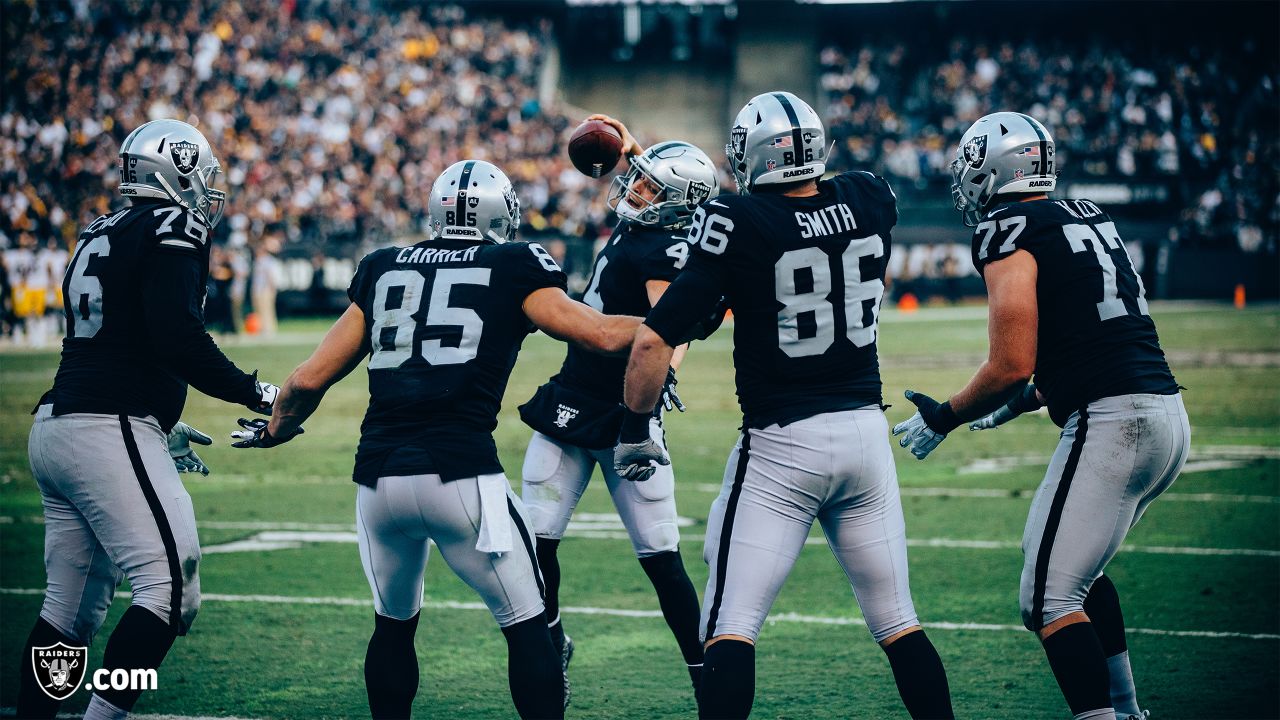 Oakland Raiders tight end Derek Carrier (85) scores a touchdown as Arizona  Cardinals defensive …