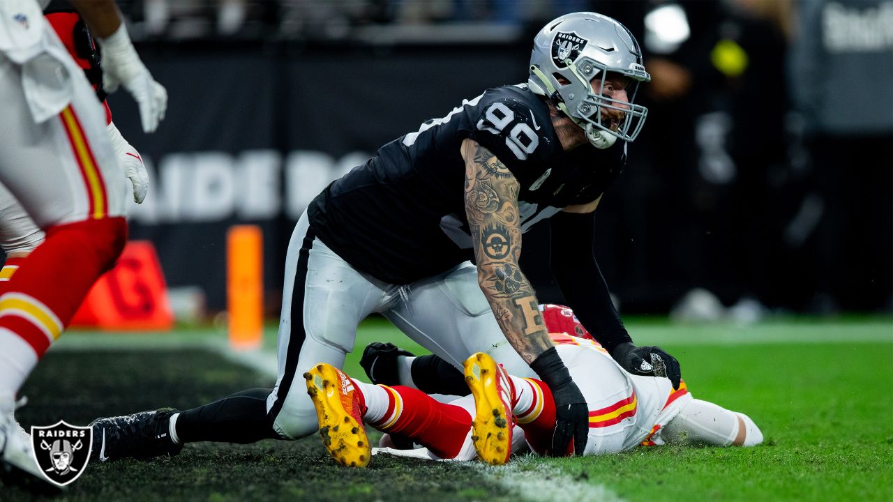 Oakland Raiders defensive end Maxx Crosby (98) gestures after being  penalized for roughing the …